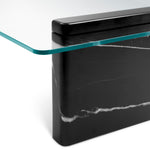 Eichholtz Coffee Table Stonecrest features a base made of black marble topped with clear glass, combining sleek modernity with