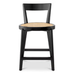 Eichholtz Counter Stool Alvear black finish that exudes timeless sophistication. The exquisite rattan cane webbing infuses a touch of
