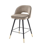 Eichholtz Counter Stool Cliff in a set of 2. Featuring black tapered legs with gold caps, the solid frame
