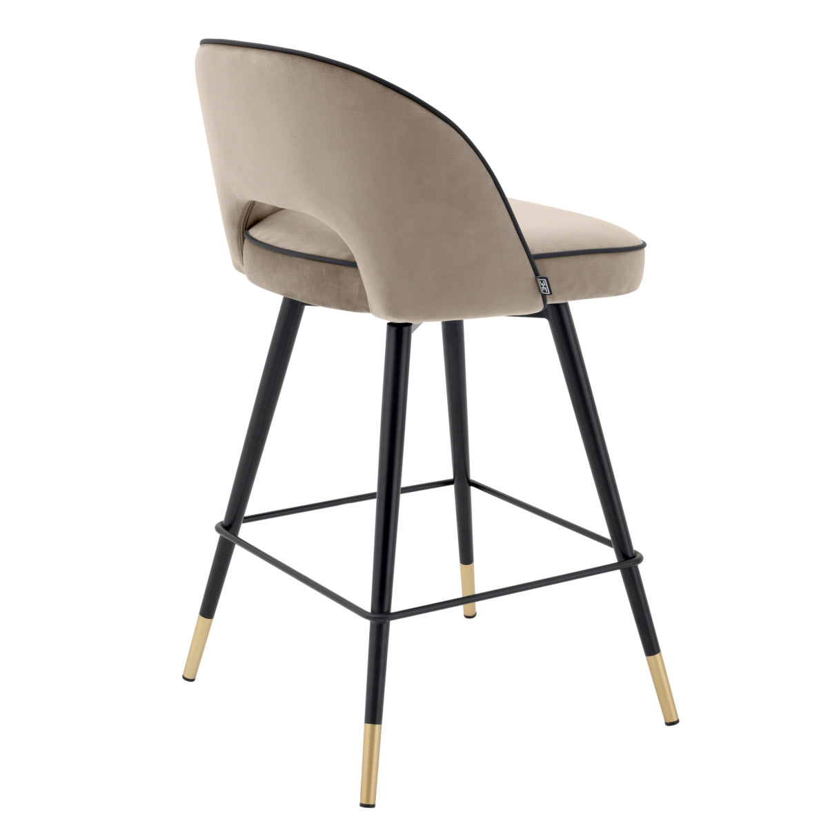 Eichholtz Counter Stool Cliff silhouette is accentuated with black faux leather piping. Counter Stool Cliff Crafted by Eichholtz this