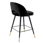 Eichholtz Counter Stool Cliff silhouette is accentuated with black faux leather piping. Counter Stool Cliff Crafted by Eichholtz this