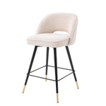 Eichholtz Counter Stool Cliff a set of 2. Featuring black tapered legs with gold caps, the solid frame holds