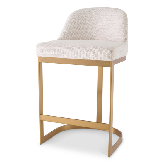 Eichholtz Counter Stool Condos Introducing the Counter Stool Condos, a masterpiece of luxury in captivating Lyssa Off-White. The brushed