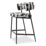 Eichholtz Counter Stool Folsom artistry of the Eichholtz Counter Stool Folsom. This exclusive piece features bold Brooklyn black fabric