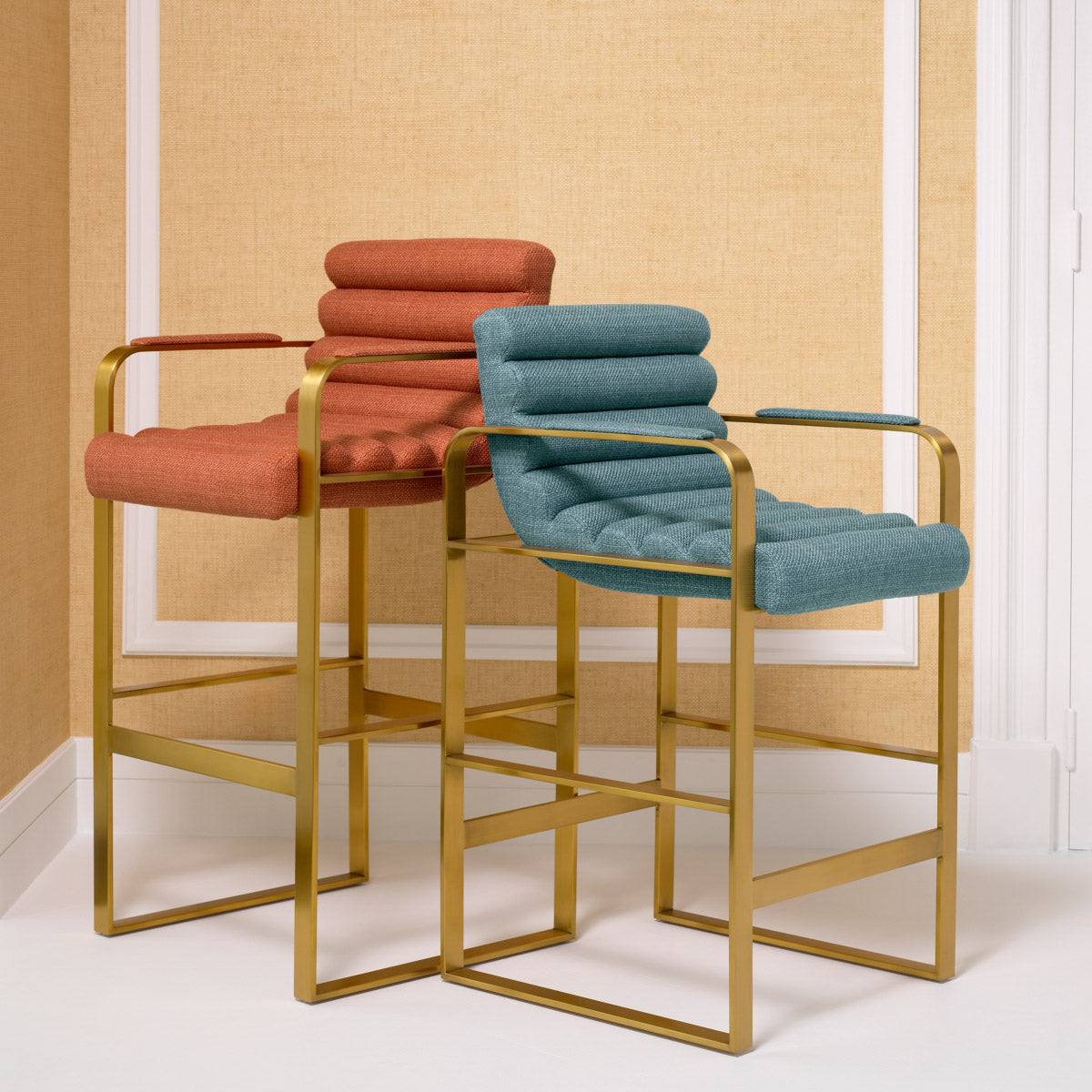 Eichholtz Counter Stool Olsen Counter Stool in Scalea orange. Celebrate artisan craftsmanship with its plush metal body draped in