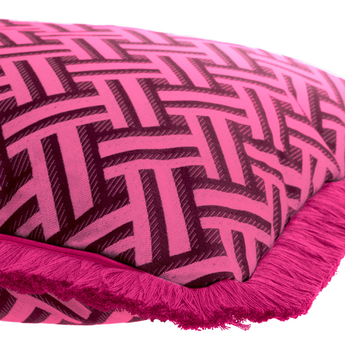 Eichholtz Cushion Doris S accentuated by dark pink fringe accents. The vibrant pink Doris print on a white backdrop