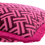 Eichholtz Cushion Doris S accentuated by dark pink fringe accents. The vibrant pink Doris print on a white backdrop