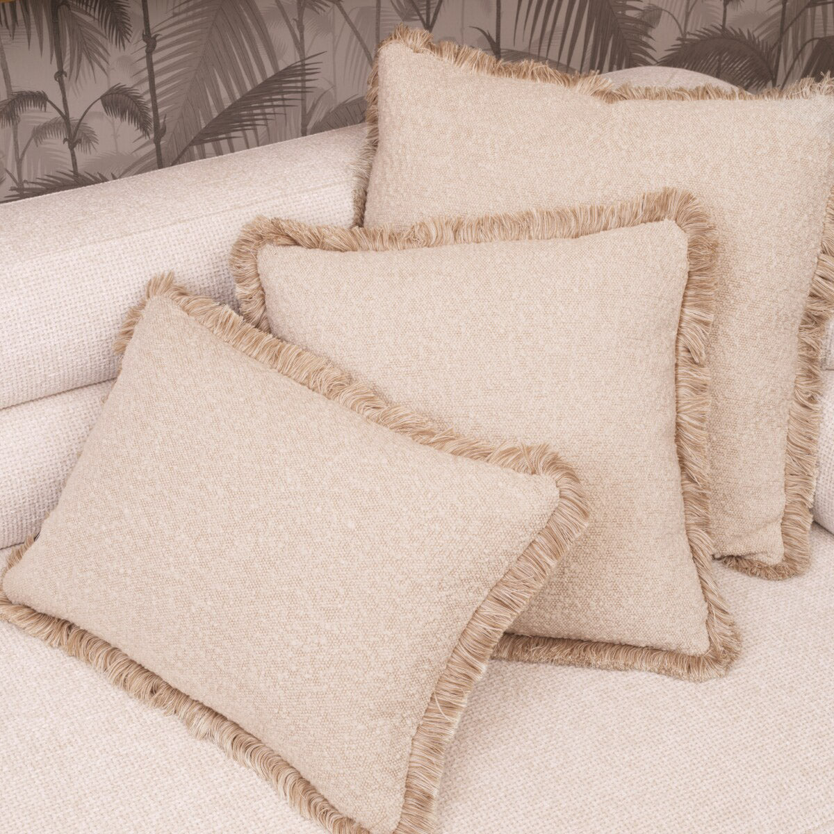 Eichholtz Cushion Nami L any living space. This exquisite cushion with fringes boasts artisan craftsmanship, featuring a bouclÃ© cream