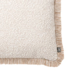 Eichholtz Cushion Nami S fabric that invites touch, bordered with a beige fringe for a timeless aesthetic. Part of