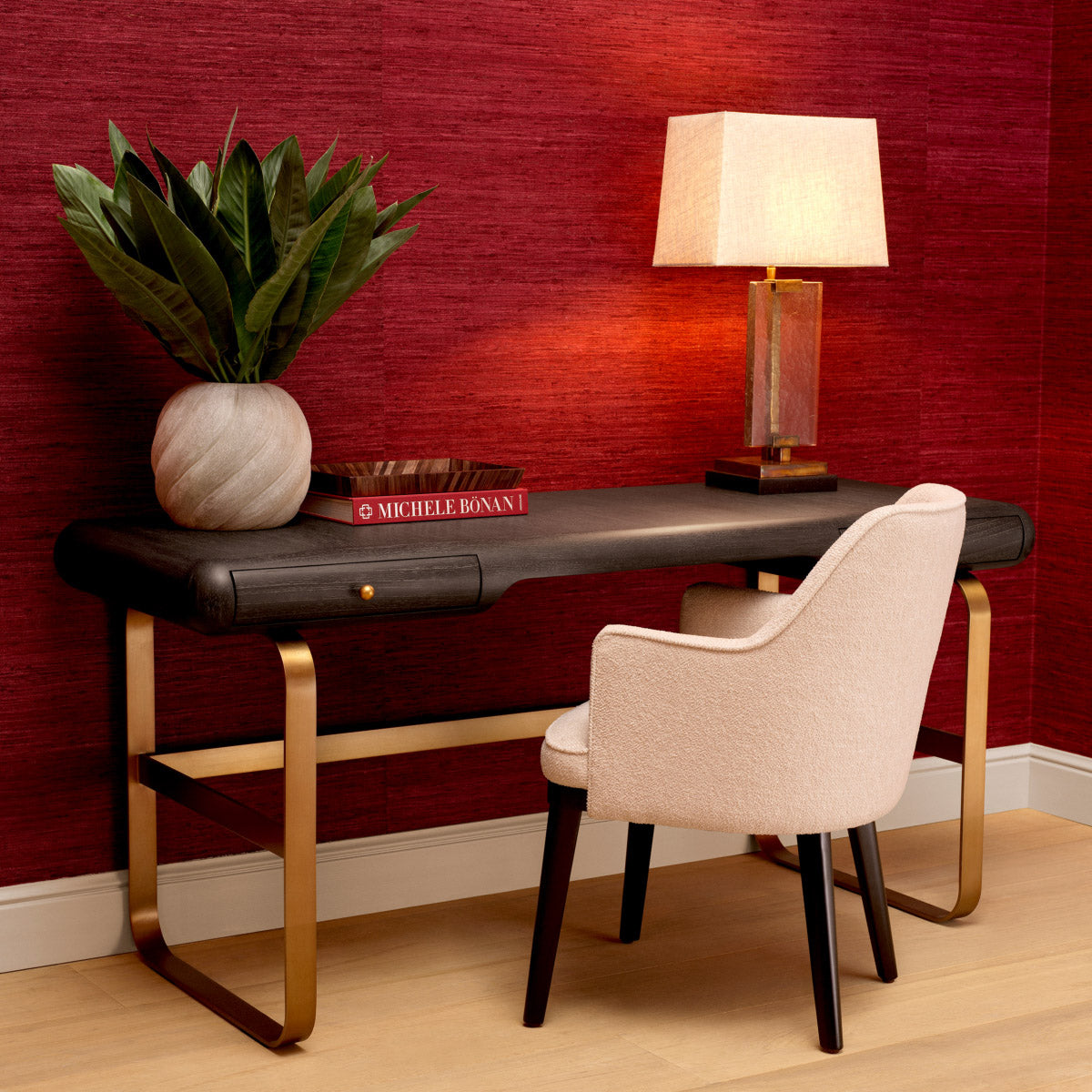 Eichholtz Desk Nathaniel sleek brushed brass finish. Its gracefully rounded silhouette and dual drawers blend sophistication with utility,