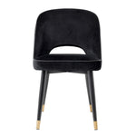 Eichholtz Dining Chair Cliff open at the bottom before the seat. Its stylish silhouette is accentuated with black faux