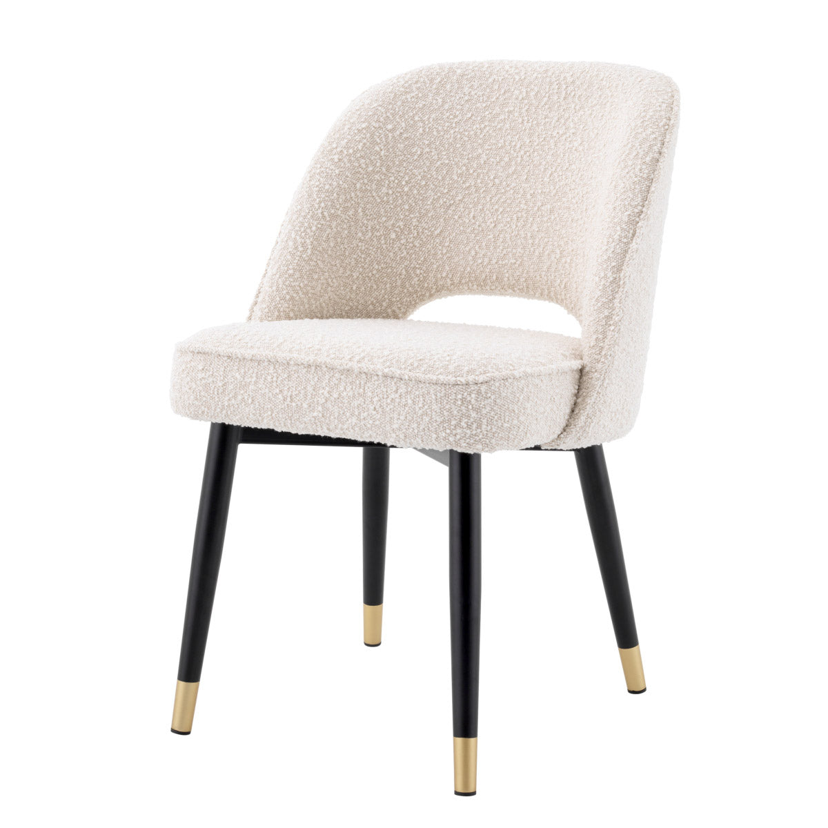 Eichholtz Dining Chair Cliff 2. Covered in cream-coloured bouclÃ©, it features tapered black legs with brass finish caps. The