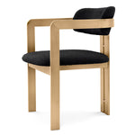 Eichholtz Dining Chair Donato the rounded backrest. The frame features a brushed brass finish and the seat is upholstered