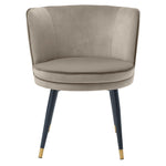 Eichholtz Dining Chair Grenada tapered legs with gold caps and a swivel seat that is upholstered in Savona greige