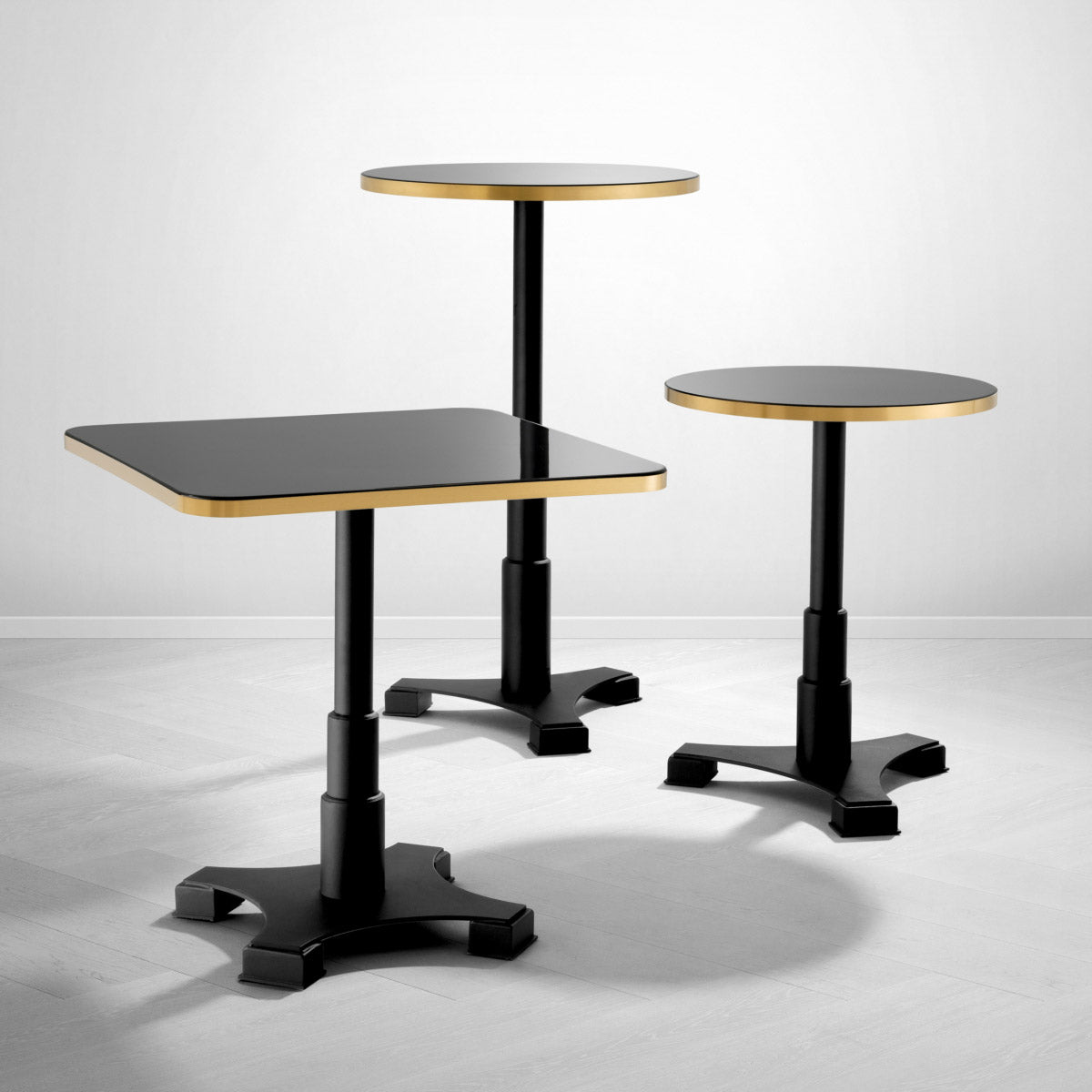 Eichholtz Dining Table Avoria Square Featuring a sleek black base and a shiny black tabletop with brushed brass rim, this