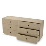Eichholtz Drawer Chest Dimitrios panels and burnished bronze accents, this piece transcends modern luxury. The refined finish offers an