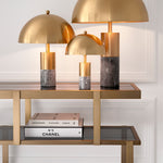 Eichholtz Dresser Nesto room or study. Its stepped carcass has a brushed brass finish and sits on an