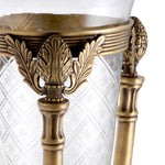 Eichholtz Hurricane Rothschield hurricane features a granite base with an ornate hurricane holder in a vintage brass finish.