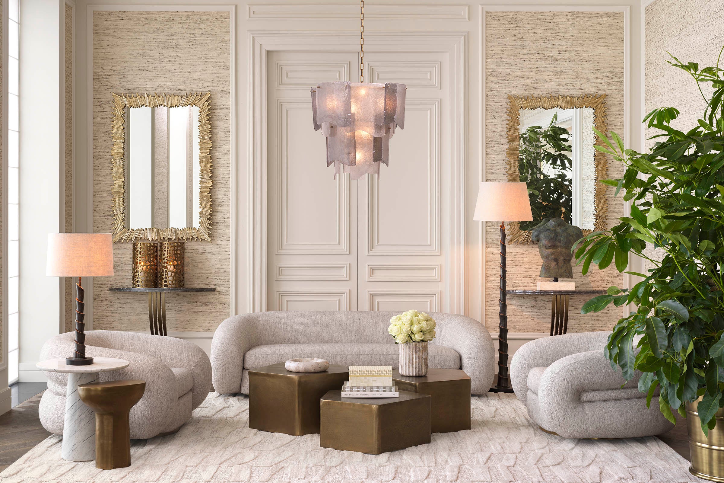 A curated Eichholtz living-room vignette — cream seating, crystal chandelier, panelled walls — the kind of room a creator might feature to their audience.