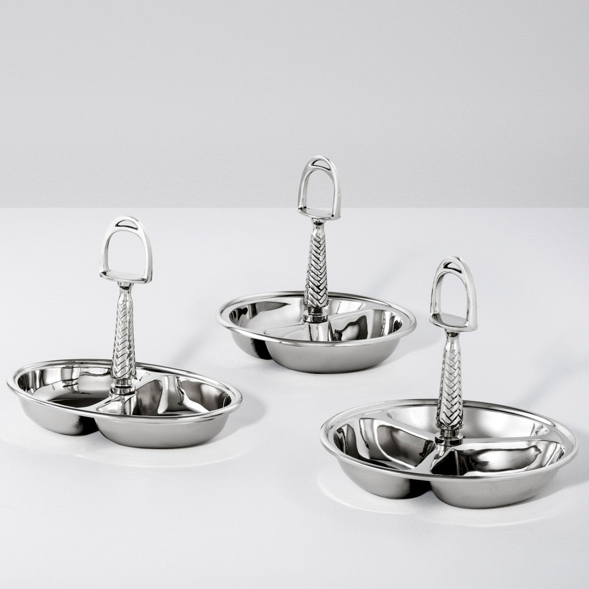 Eichholtz Nut Bowl Wisard serving surface. Exuding Equestrian style, it has a stirrup design lifting handle which completes the