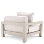 Eichholtz Outdoor Chair Cap-Antibes a powdercoated sand finish. Its seat and back cushions are upholstered in Sunbrella canvas. Outdoor