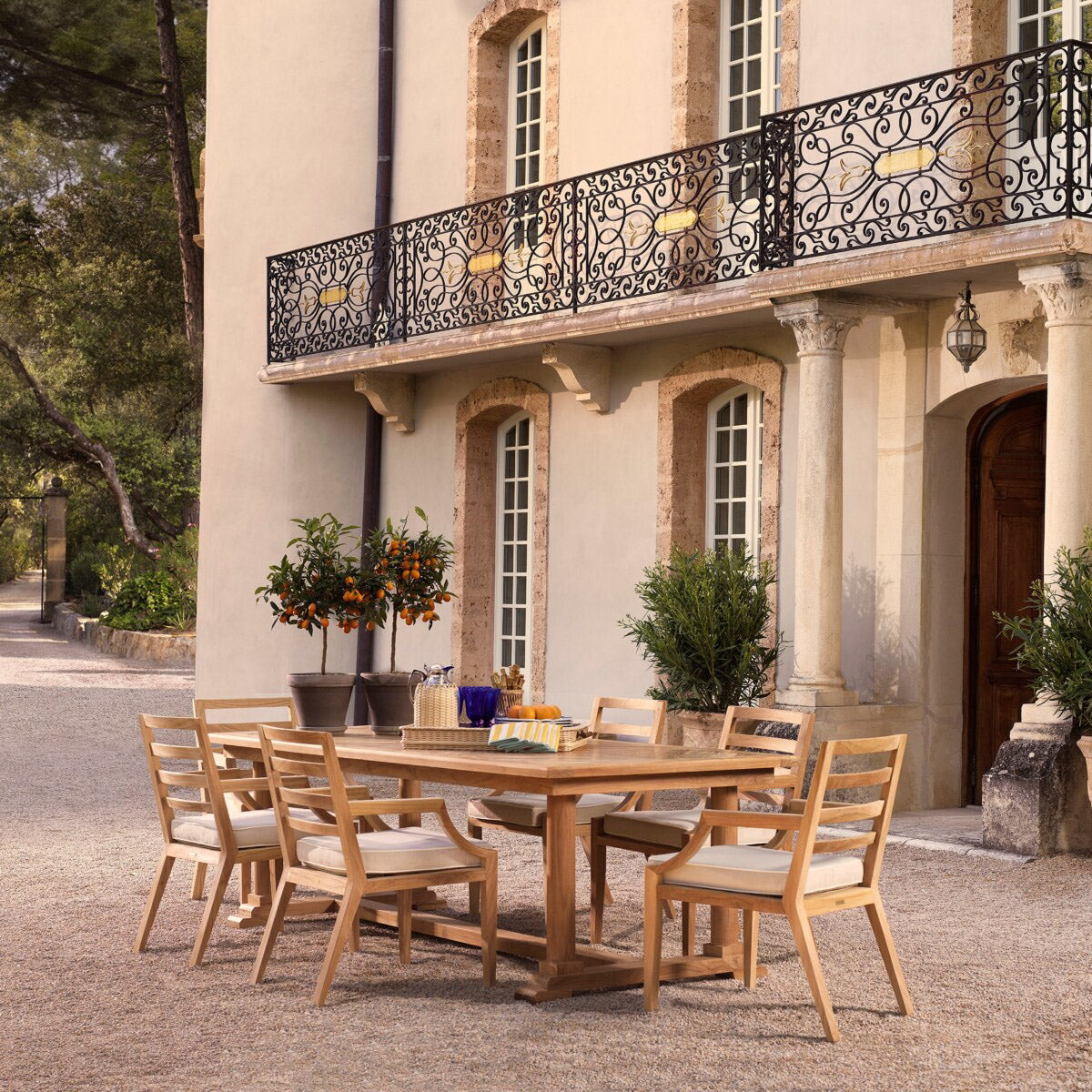 Eichholtz Outdoor Dining Chair Hera its stylish curved arm rests, sturdy design and boasting a rich honey brown Grade A