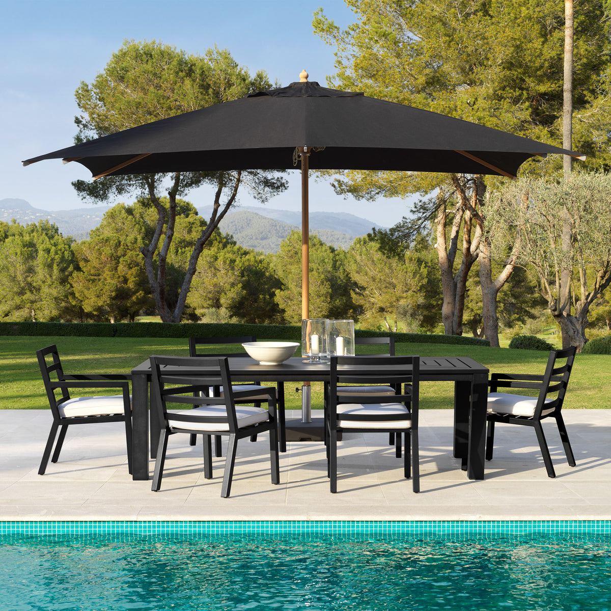 Eichholtz Outdoor Dining Table Vistamar for long-term outdoor use, this luxurious black finish dining table with decorative slits will add