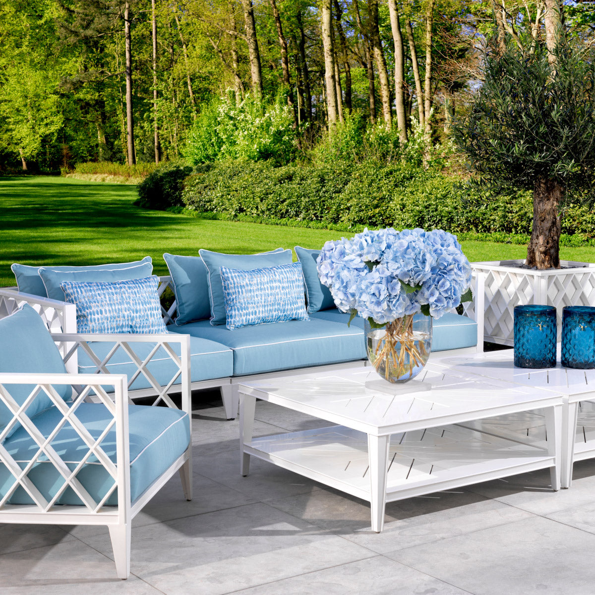 Eichholtz Outdoor Sofa Ocean Club L finish frame and plush cushions it offers an ultra-comfortable seating experience. The mineral blue S...