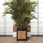 Eichholtz Planter Aruba a classic black finish, the combination of natural sea grass rush adds a touch of