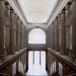 Eichholtz Print 3 Interior columns, leading to a vast open space. Encased in a grey wooden frame with clear