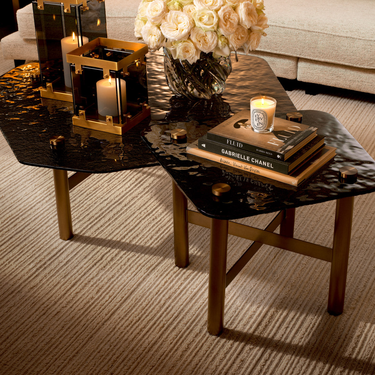 Eichholtz Side Table Cortes smoke glass top adds a touch of sophistication, while the brushed brass finish on the