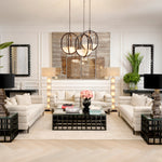 Eichholtz Side Table Cubico classic black finish and a unique geometric base crafted from sleek black glass, embodying a