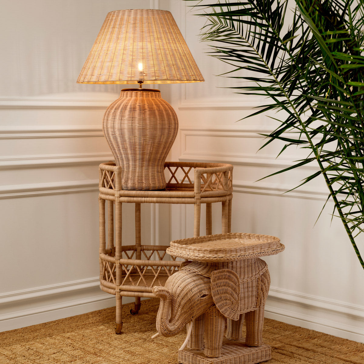 Eichholtz Side Table Elephant elevates your space. Expertly crafted from natural rattan, this iconic table showcases intricate detailing and