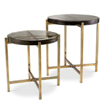 Eichholtz Side Table Haymann set of 2 The Haymann Side Table set combines a vintage brass finish with thick, handcrafted glass tabletops