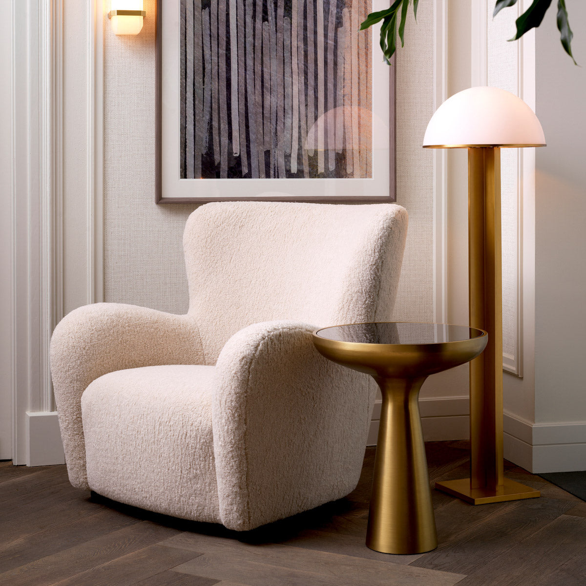 Eichholtz Side Table Lindos low This stunning round end table features a brushed brass finish base and a black glass