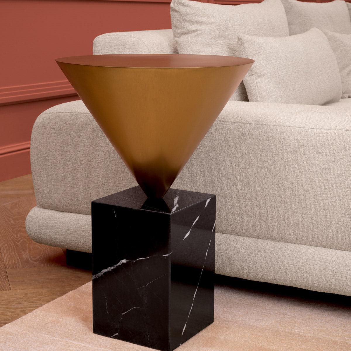 Eichholtz Side Table Nota top of black marble with a warm brass finish. Its sophisticated silhouette embodies modern luxury,
