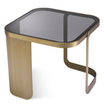 Eichholtz Side Table Numa Numa Side Table that has a brushed brass frame and a smoked glass tabletop. A