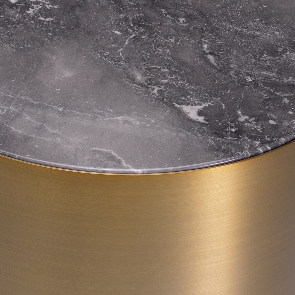 Eichholtz Side Table Porter round base and a grey marble top. The warm look of the brass counterpoints the cool