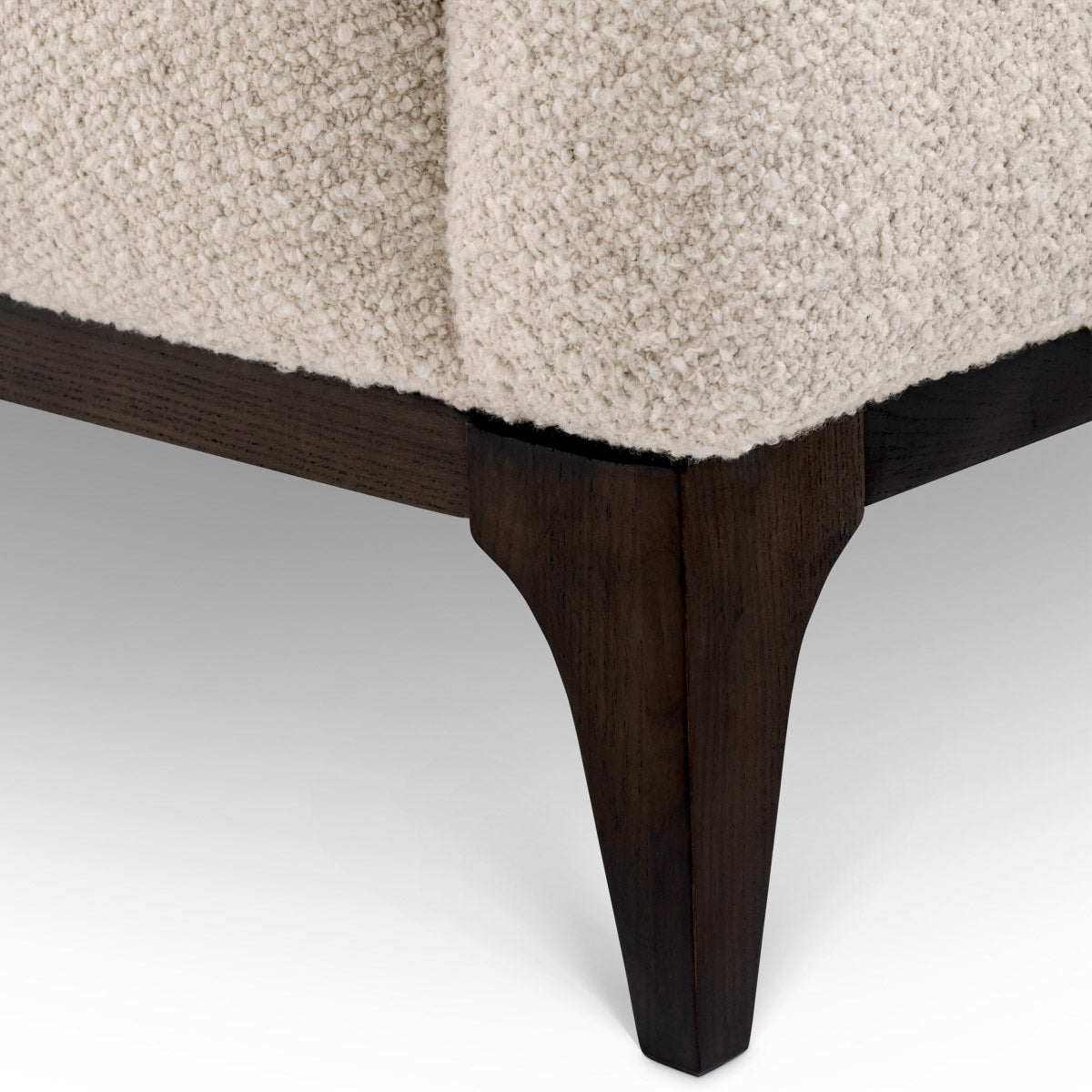 Eichholtz Sofa Brannan sophisticated charm. The contrasting black base adds a sleek touch, making it a striking centerpiece