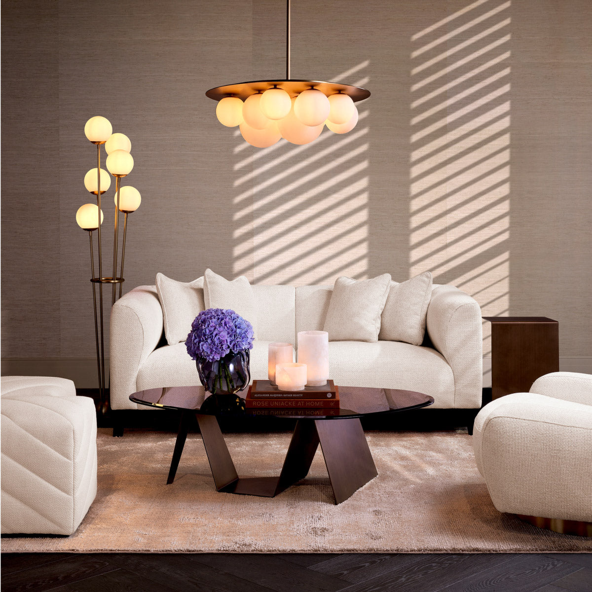 Eichholtz Sofa Corso S Upholstered in luxurious Lyssa off-white fabric and supported by sleek black feet, this compact piece