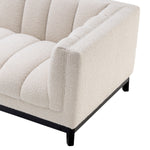 Eichholtz Sofa Ditmar and upholstered in cream-coloured bouclÃ©, Sofa Ditmar will bring lots of charm and warmth to
