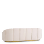 Eichholtz Sofa Inger deep stitching, whilst the cream-coloured fabric is underlined by a brushed brass base. Perfect for