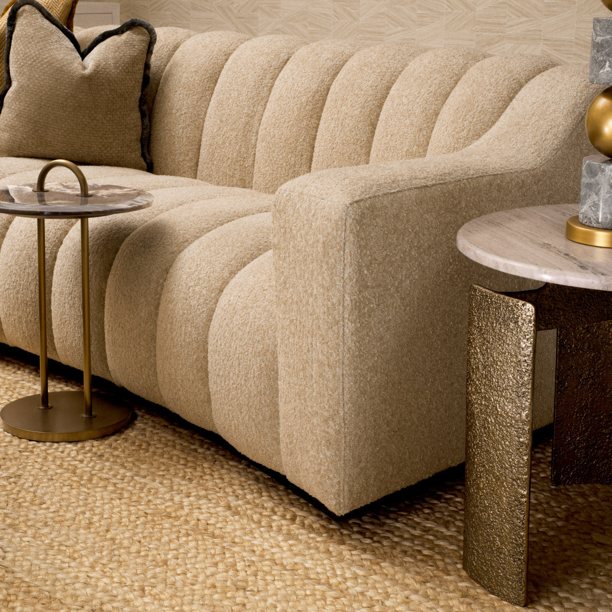 Eichholtz Sofa Kelly S cascade sand finish. This exclusive piece promises to transform your living room with its blend