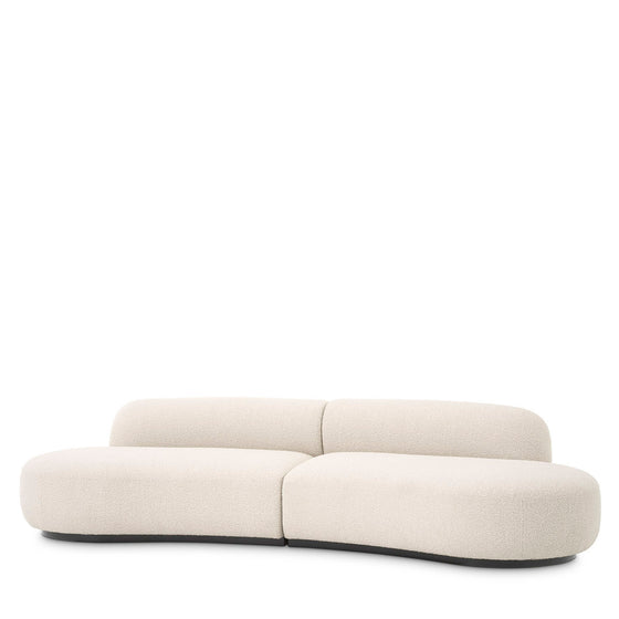 Eichholtz Sofa Björn S Enjoy the rich comfort and the striking boomerang-like design of Sofa Björn. Organic in shape