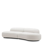 Eichholtz Sofa Björn S "Finished in muslin white, Sofa Björn S brings forward its soft, curved shape while remaining