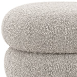 Eichholtz Stool Tulum by its unique marshmallow-like curves in bouclÃ© grey upholstery. Black feet round out the captivating