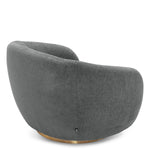 Eichholtz Swivel Chair Brice blue-coloured fabric and a brushed brass swivel base. Combine it with Sofa Brice for a