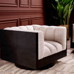 Eichholtz Swivel Chair Davide elegance. This iconic piece, swathed in skyward sand fabric, radiates tranquillity. The sophisticated black...