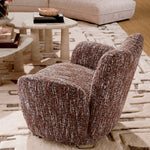 Eichholtz Swivel Chair Merida artisan craftsmanship, this chair features plush BouclÃ© Sonata red fabric, adding a luxurious touch to