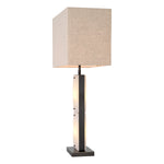 Eichholtz Table Lamp Ortiz warmly diffusing through the base for an inviting glow. Perfect for enhancing the ambience of